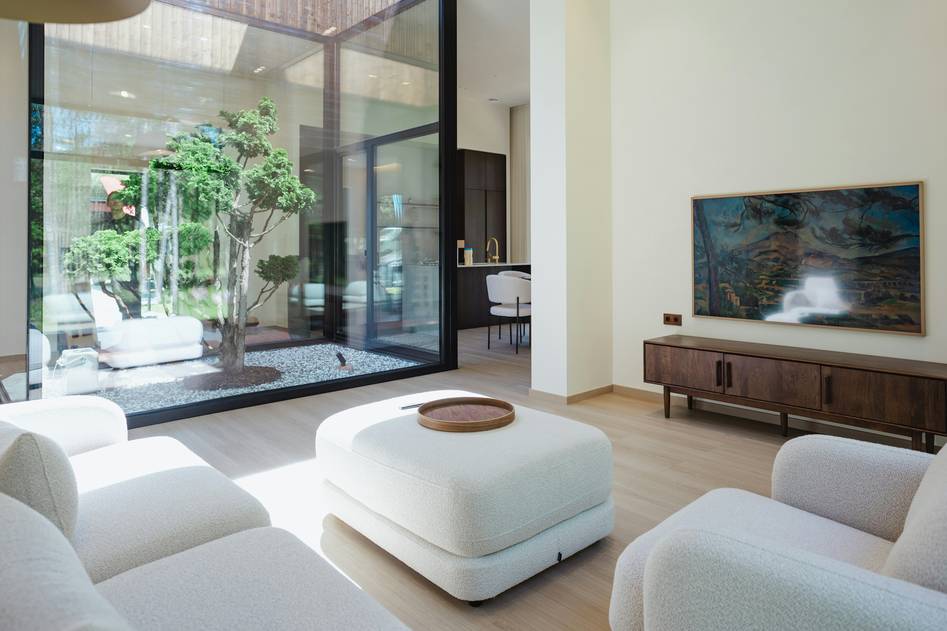 Abstract painting with soft neutral tones and fluid shapes on a minimalist wall