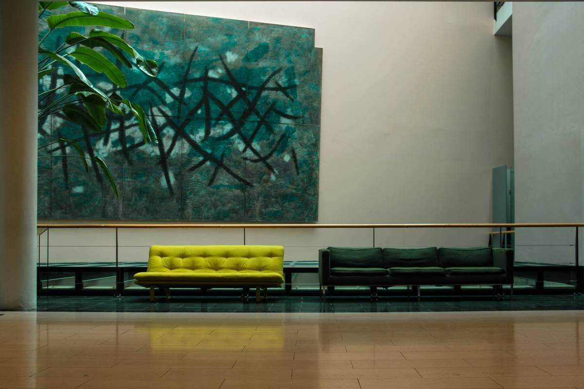 Large-scale modern wall art decor abstract dominating a neutral living room